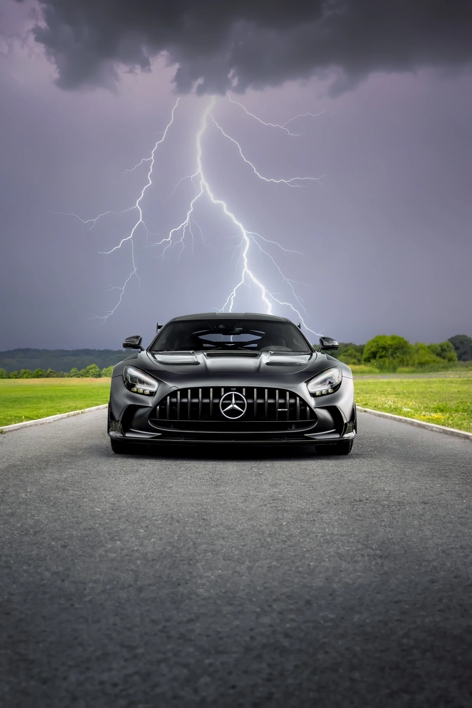 Mercedes-AMG GT Black Series head-on beneath lightning and storm clouds