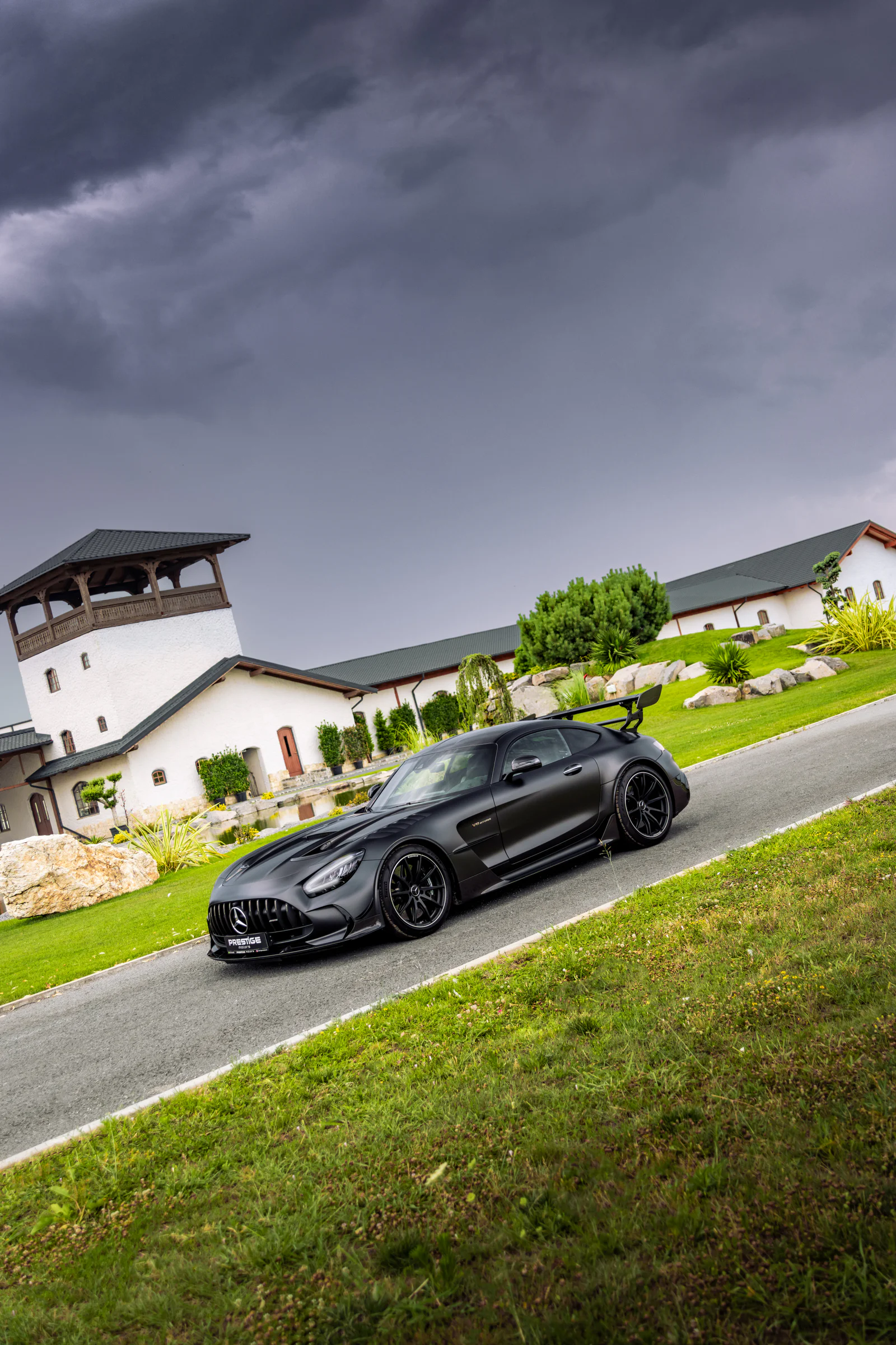 Angled three-quarter portrait of the Black Series beneath storm clouds