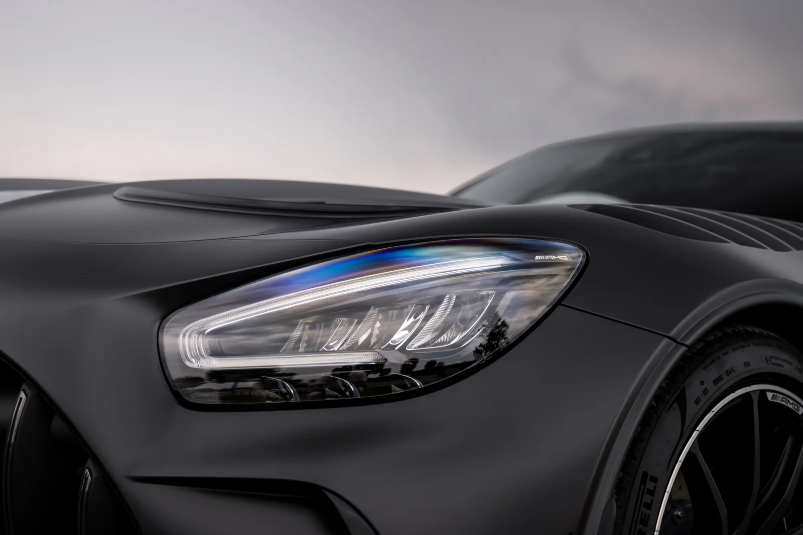 Close view of the sculpted bonnet and AMG headlight