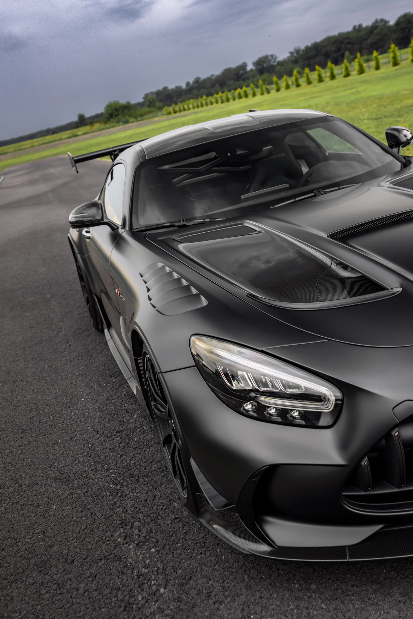 Angled portrait of the carbon bonnet vents and front quarter