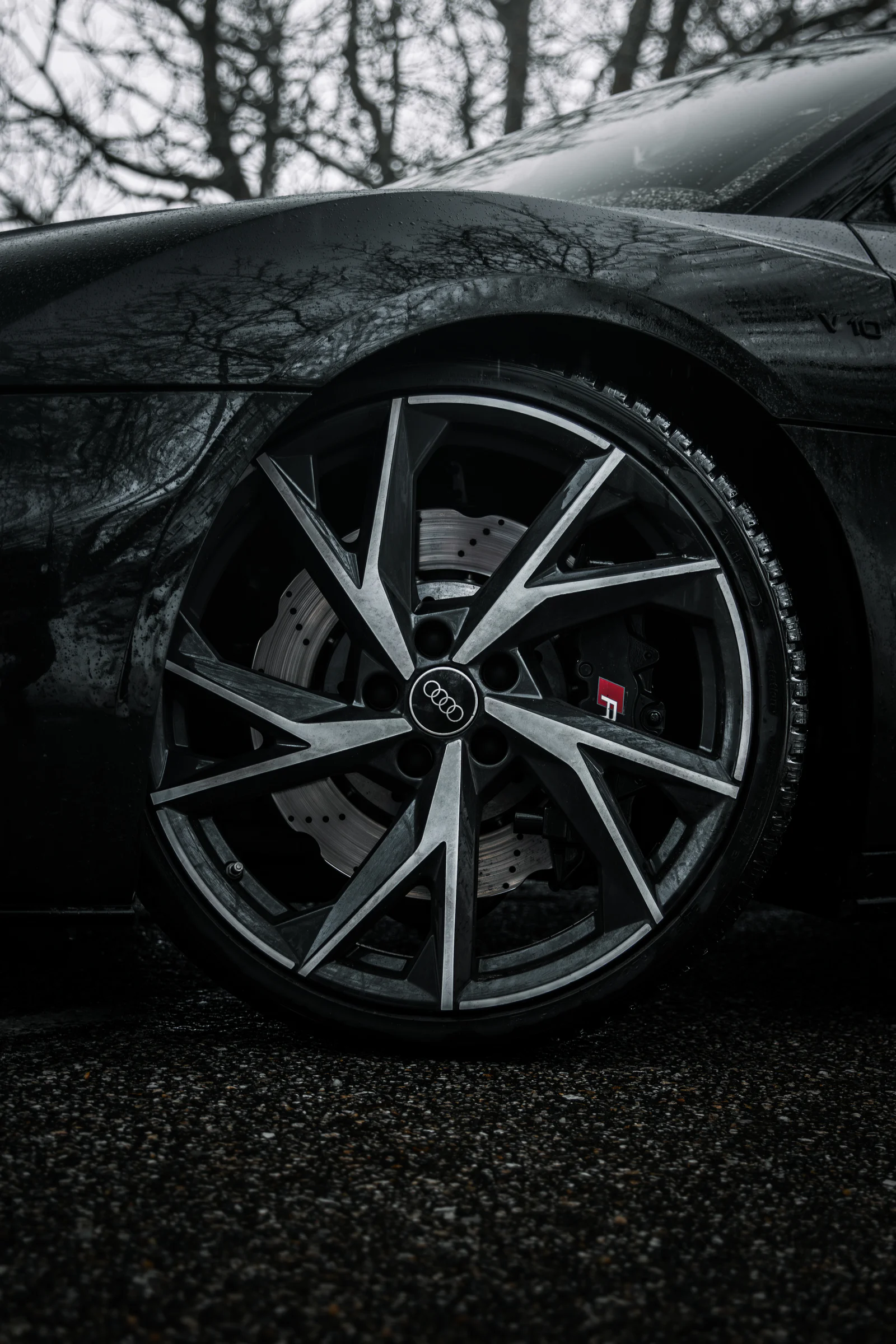 Angular alloy wheel and red R brake-caliper badge