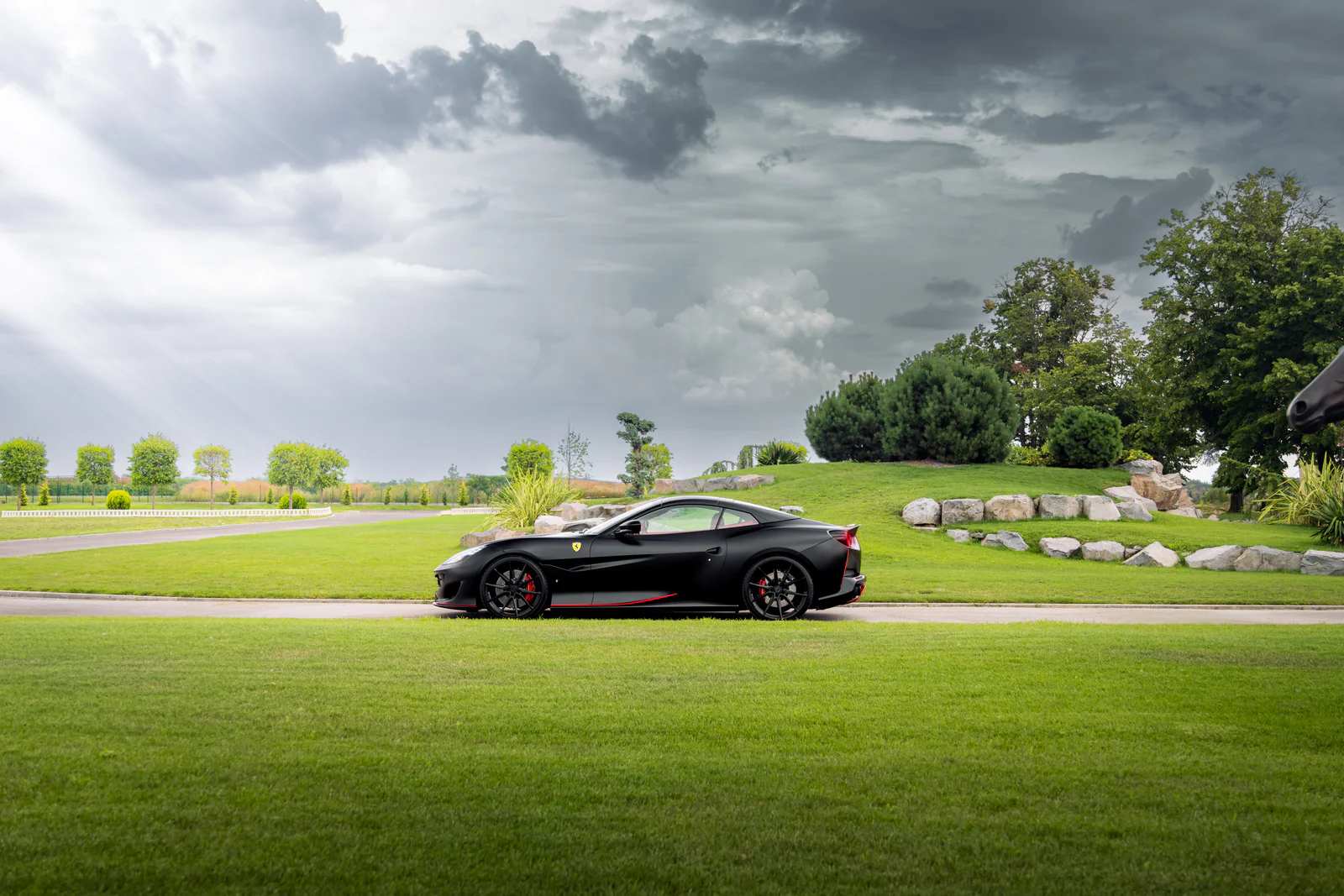 Wide side profile of the Portofino within green landscaped grounds